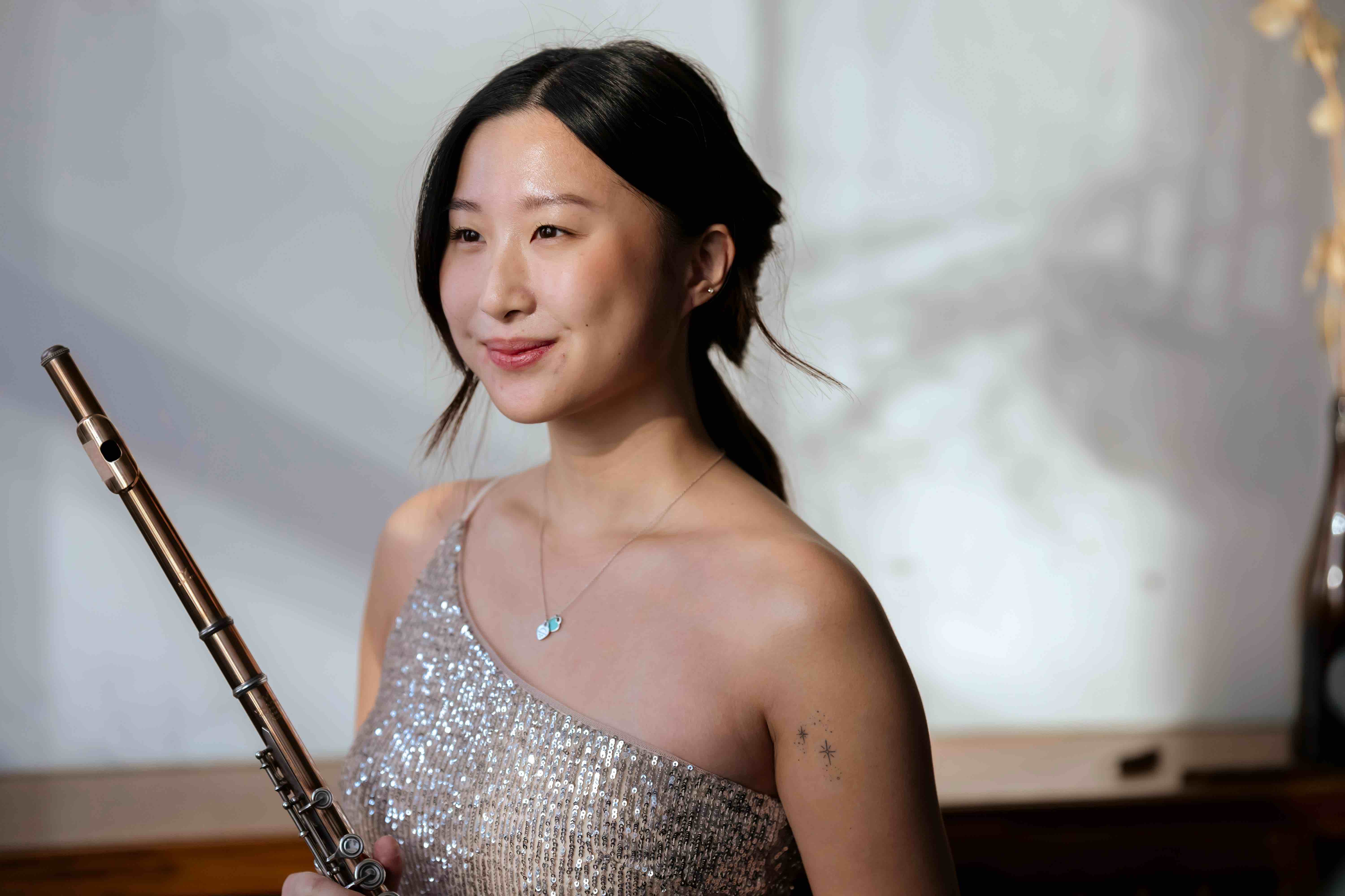 Flutist performing on stage